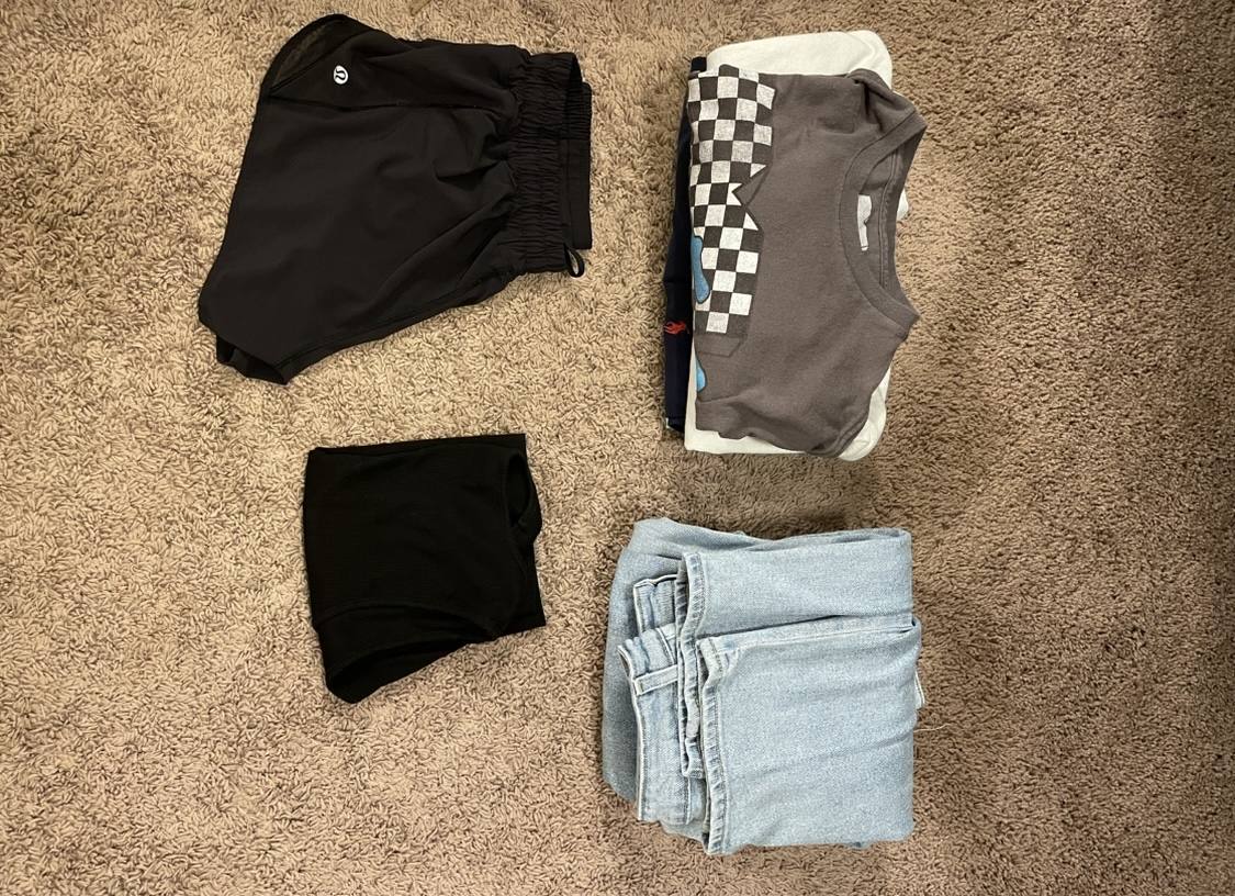 Folded clothes laid out in neat stacks
